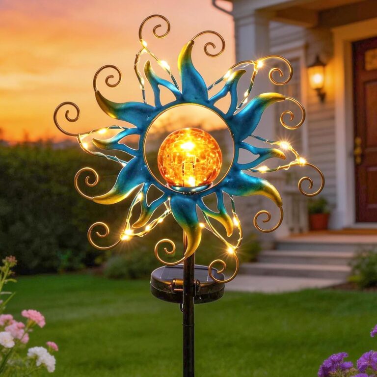 Kacux blue metal sun solar garden stake light with crackle glass globe, emitting a warm glow in an outdoor setting.