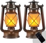 Two Marlrin vintage bronze LED lanterns with dancing flames, one hanging and one on a table, in an outdoor setting.