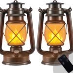 Two Marlrin vintage bronze LED lanterns with dancing flames, one hanging and one on a table, in an outdoor setting.