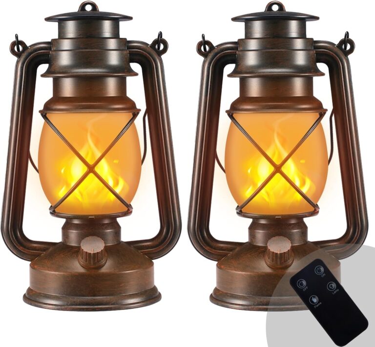 Two Marlrin vintage bronze LED lanterns with dancing flames, one hanging and one on a table, in an outdoor setting.