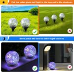 Six MLKNK solar globe lights with cracked glass texture, emitting a multicolor glow, placed in a garden setting.