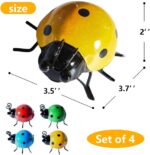 Four colorful metal ladybug sculptures displayed on a garden wall and a green lawn, showcasing their vibrant hues.