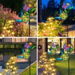 A blue butterfly solar watering can with warm white cascading fairy lights, hanging from a shepherd hook in a garden.