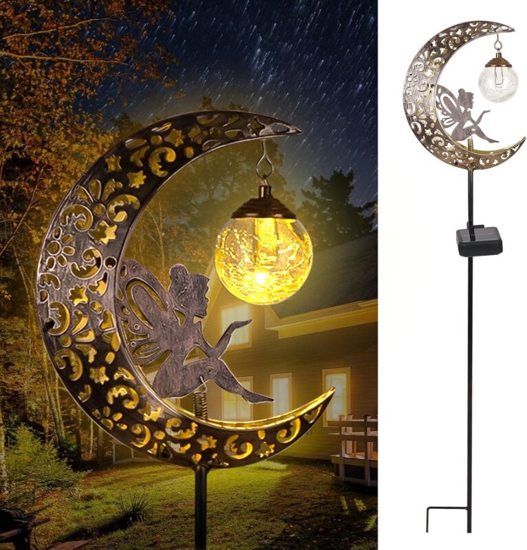 A bronze moon fairy solar garden light with a crackle glass globe, illuminating a pathway at dusk.