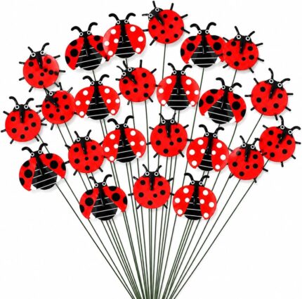 A cluster of 30 red and black 3D ladybug garden stakes, 25cm tall, inserted into green foliage and a potted plant.