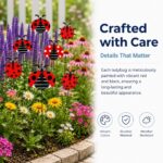 A cluster of 30 red and black 3D ladybug garden stakes, 25cm tall, inserted into green foliage and a potted plant.