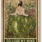 A retro-style 8x12 inch metal tin sign with the quote 'Into The Garden I Go To Lose My Mind And Find My Soul' on a plant-them